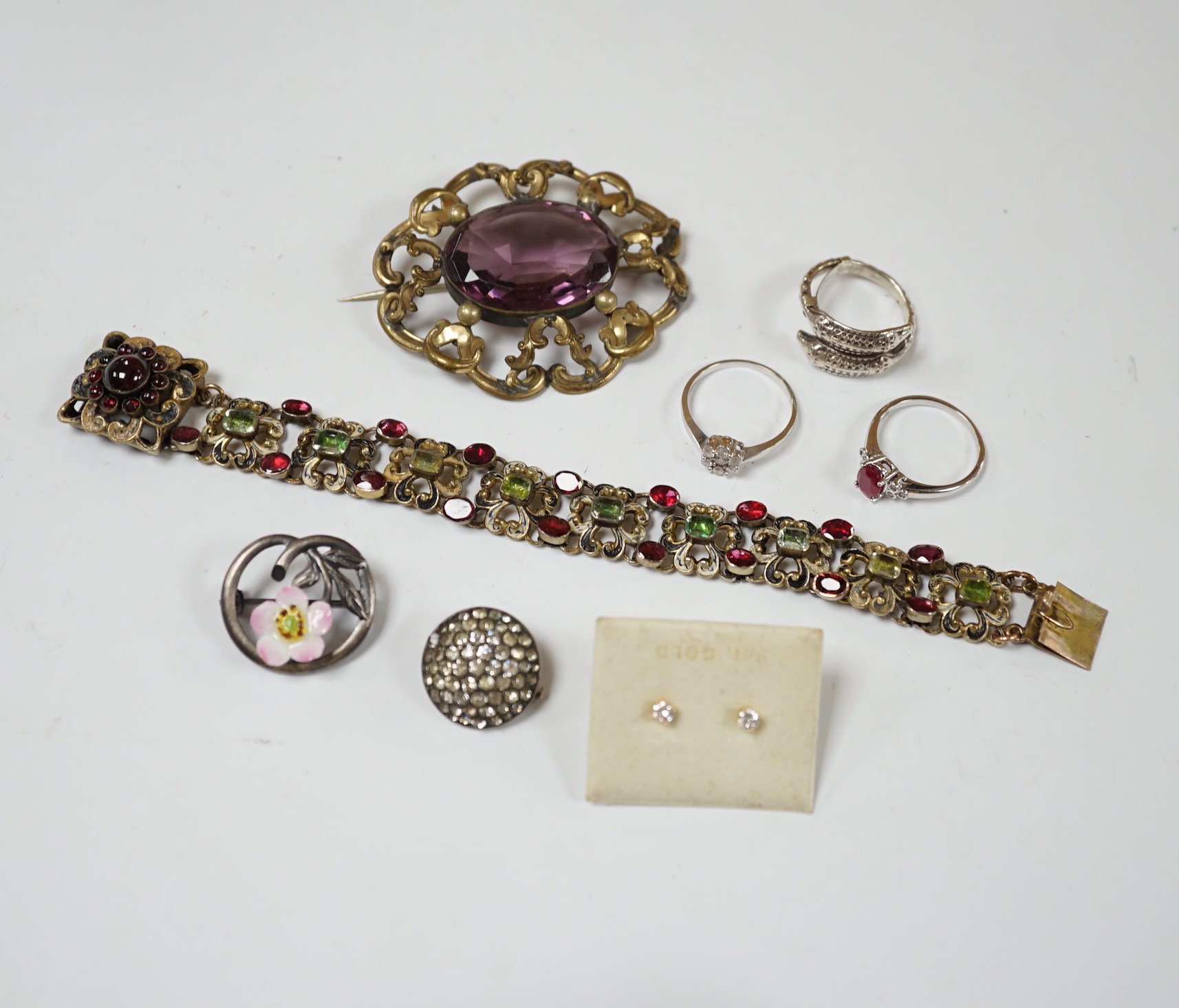 A small pair of diamond stud earrings, two 9ct white gold and gem set rings including diamond cluster and sundry other jewellery including An Austro-Hungarian style bracelet.